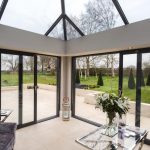 A {large} living room with a {glass} roof in Bishop's Cleeve.