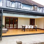A {house} with a {patio} and a {glass door} in Bishop's Cleeve.